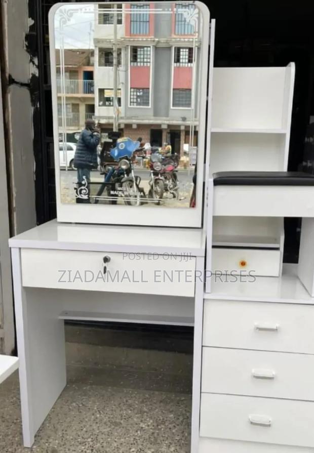 Elegant White Dressing Hidden Storage Behind Sliding Mirror