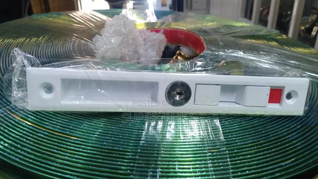 Sliding Door Lock With a Key and a Green/Red Indicator Label