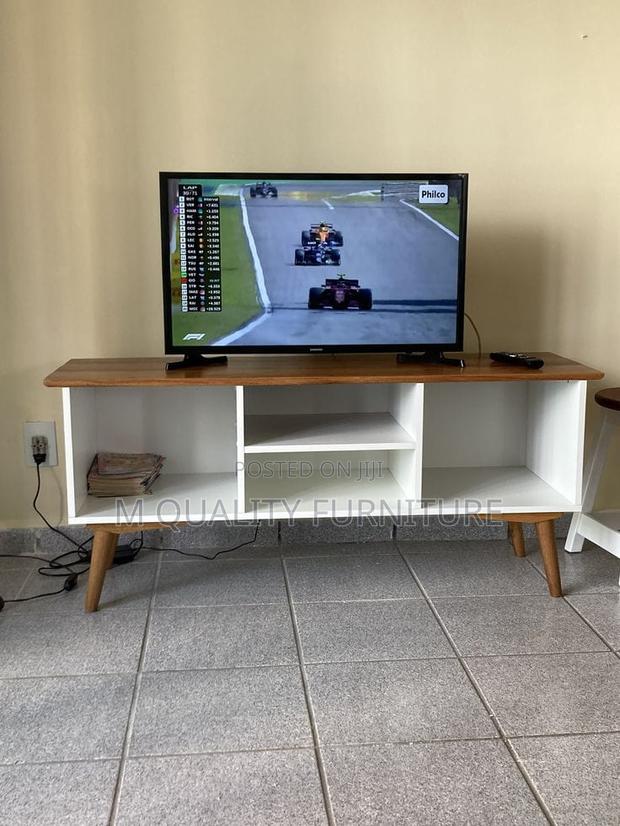 Brown Tabletop Tv Stand With in Built Storage Closets