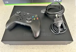 Black Xbox One X With Original Controller.