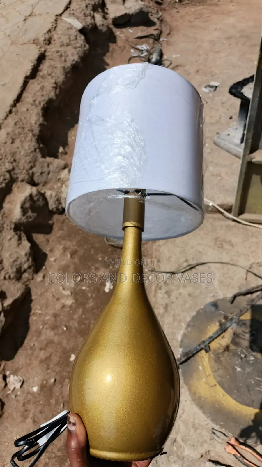 Lamp Shade With a Gold Bottle for Beside the Bed