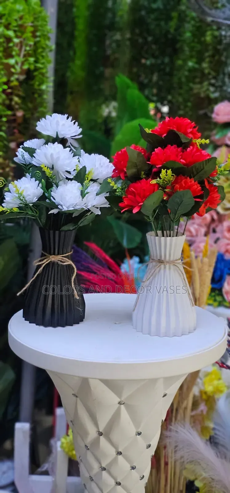 Red, White and White Plastic Vase With Flowers