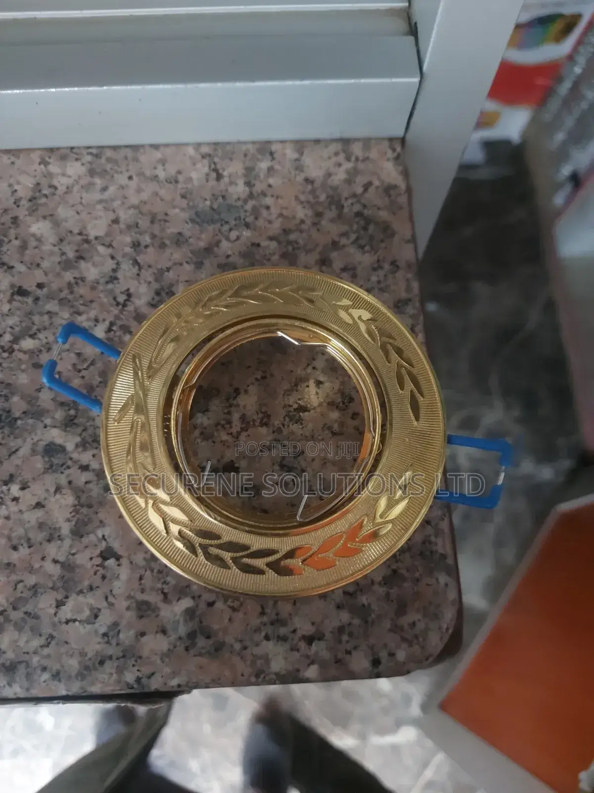 Round, Golden-Colored Recessed Spotlight Frame