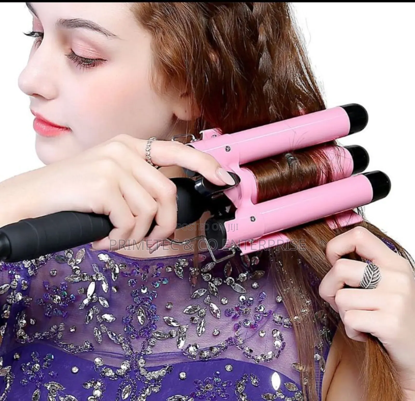 Hair Curler With Triple Barrel Iron.