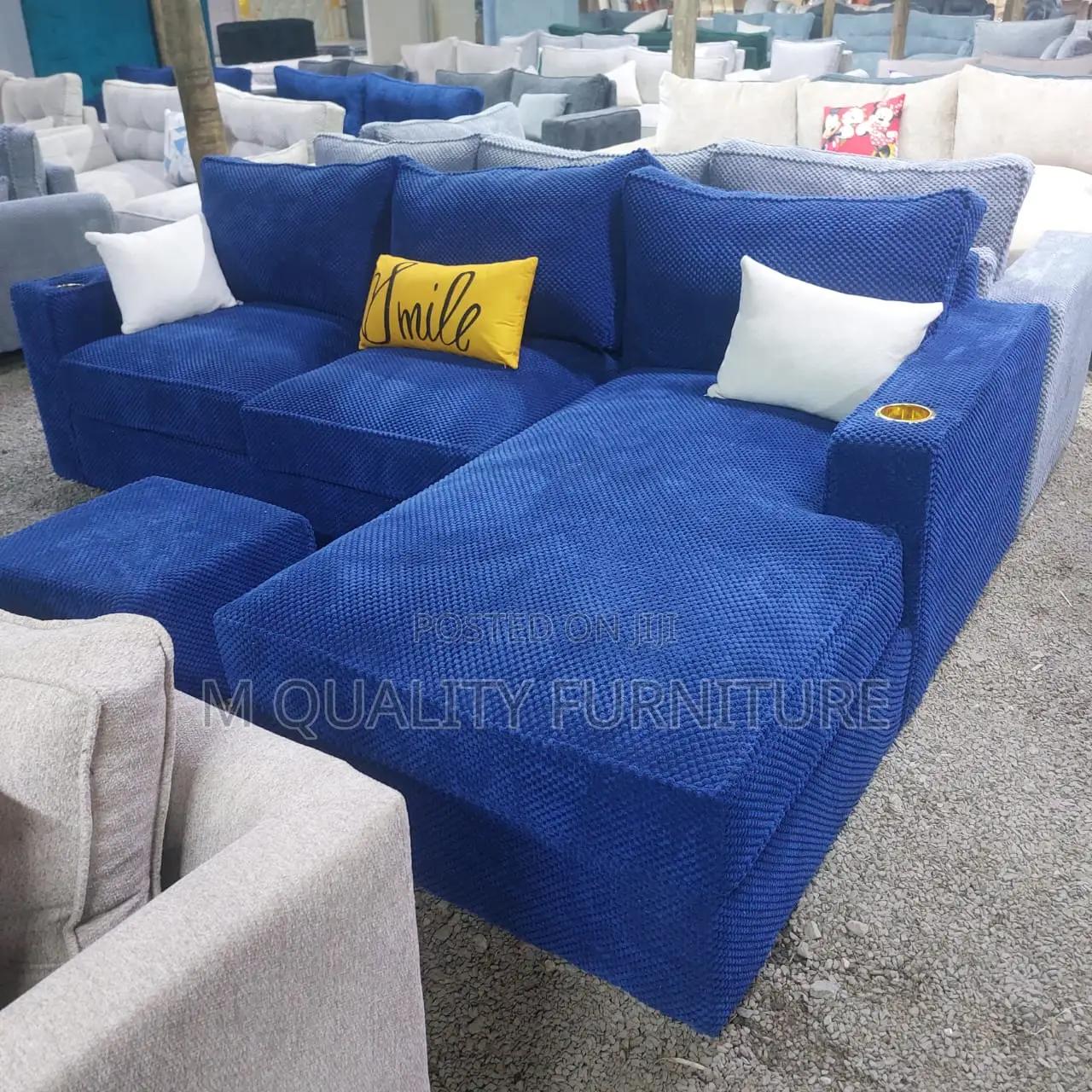 Royal Blue Sofa With a Matching Ottoman for Functionality