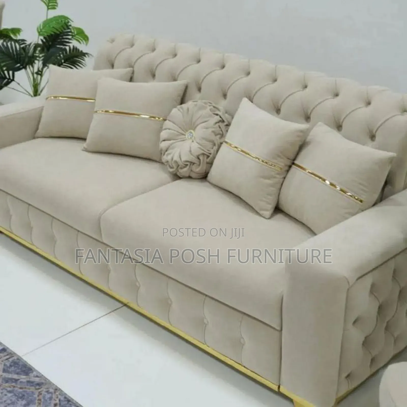 Tufted 3 Seater Sofa With Gold Accents.