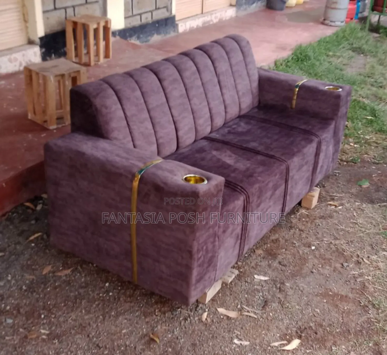 Brown Sofa With Cup Holders and Gold Accents