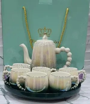 Fine Ceramic 8pc Rotating Tray Tea Set With 6 Cups and Kettle Now