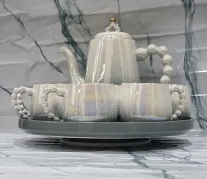 Fine Ceramic 8pc Rotating Tray Tea Set With 6 Cups and Kettle Now