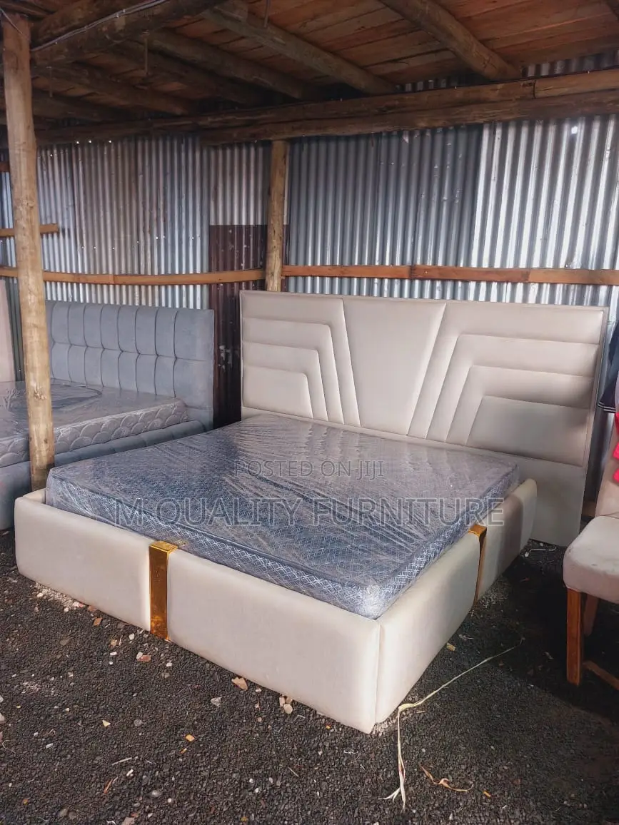 Bed With Headboard Stretching Beyond Its Width