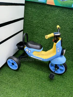 Toddlers Riding Tricycle