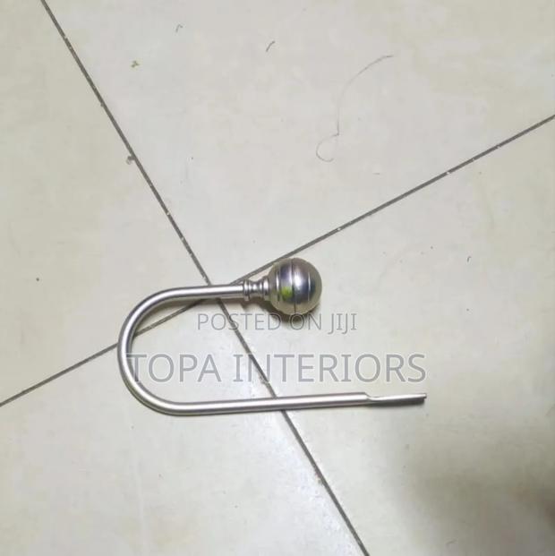 Metallic Wall Curtain Holders to Act as Curtain Tiebacks