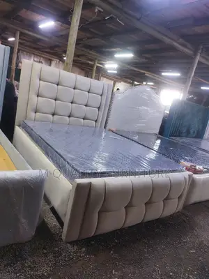 A Fabric Upholstered Bed in Neutral Tone