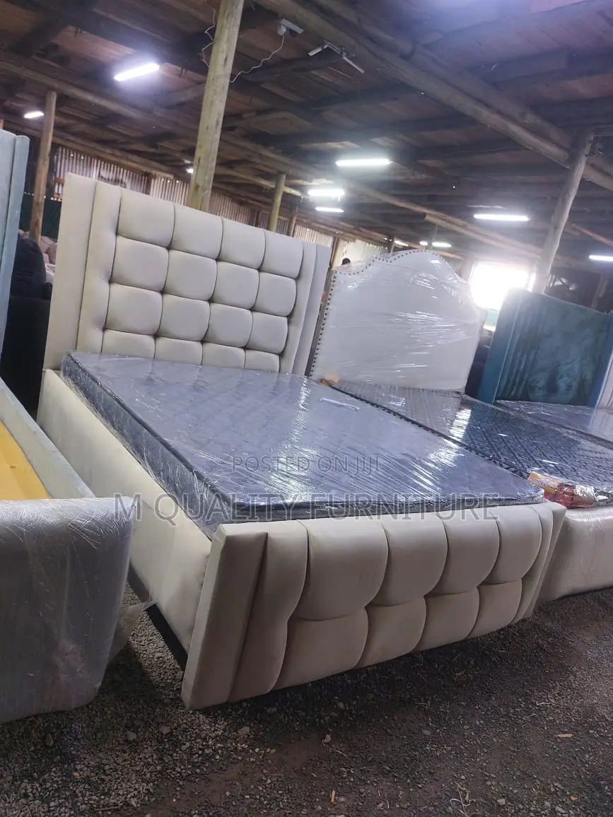 A Fabric Upholstered Bed in Neutral Tone