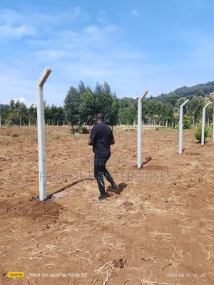 Concrete Posts + Chain Link Fencing