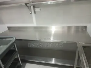Shiny Stainless Institutional Working Table Available