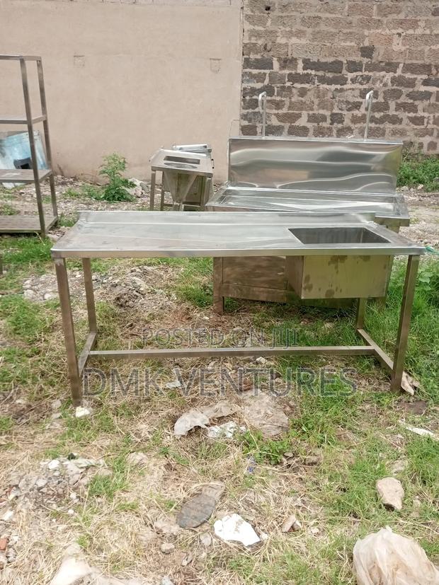 Embraced Stainless Single Washing Sink With a Spacious Working Table - main view