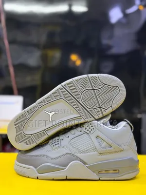 The Air Jordan 4 Retro "Wet Cement" Sneakers