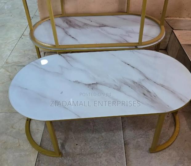 Luxury That Makes a Statement
 Oval Glass Marble Coffee Table
