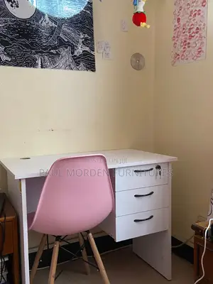 Office Desk With Pink Eames Chair 7700