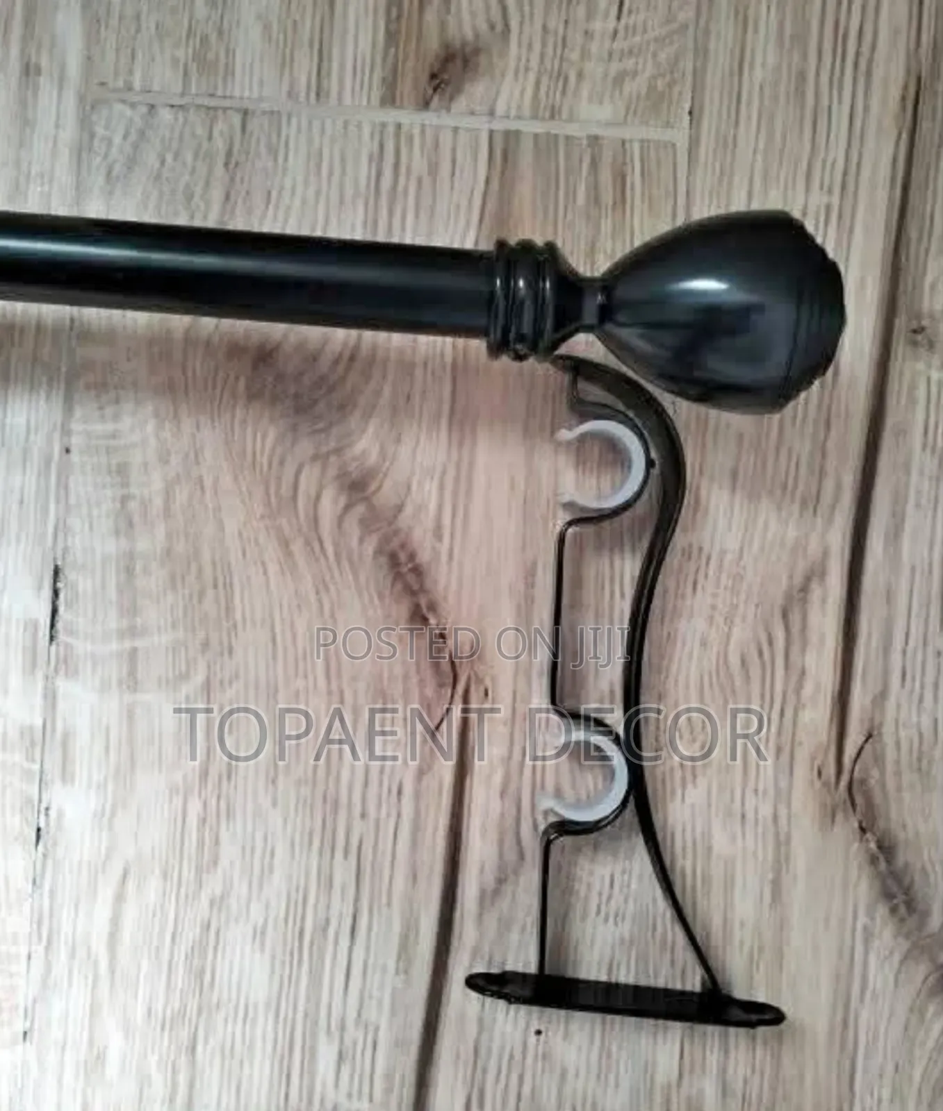 Black Powder Coated Curtain Rod With a Bracket