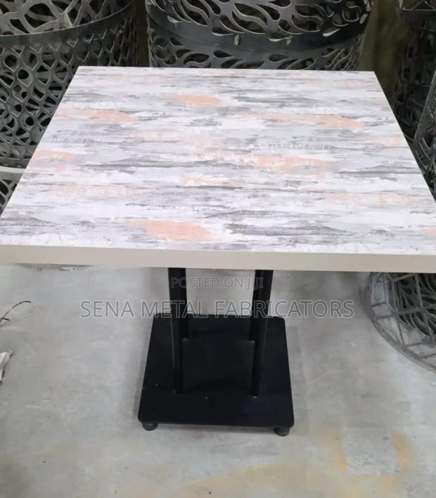 Plate Base Restaurant Table With Glossy Marble Look Top.