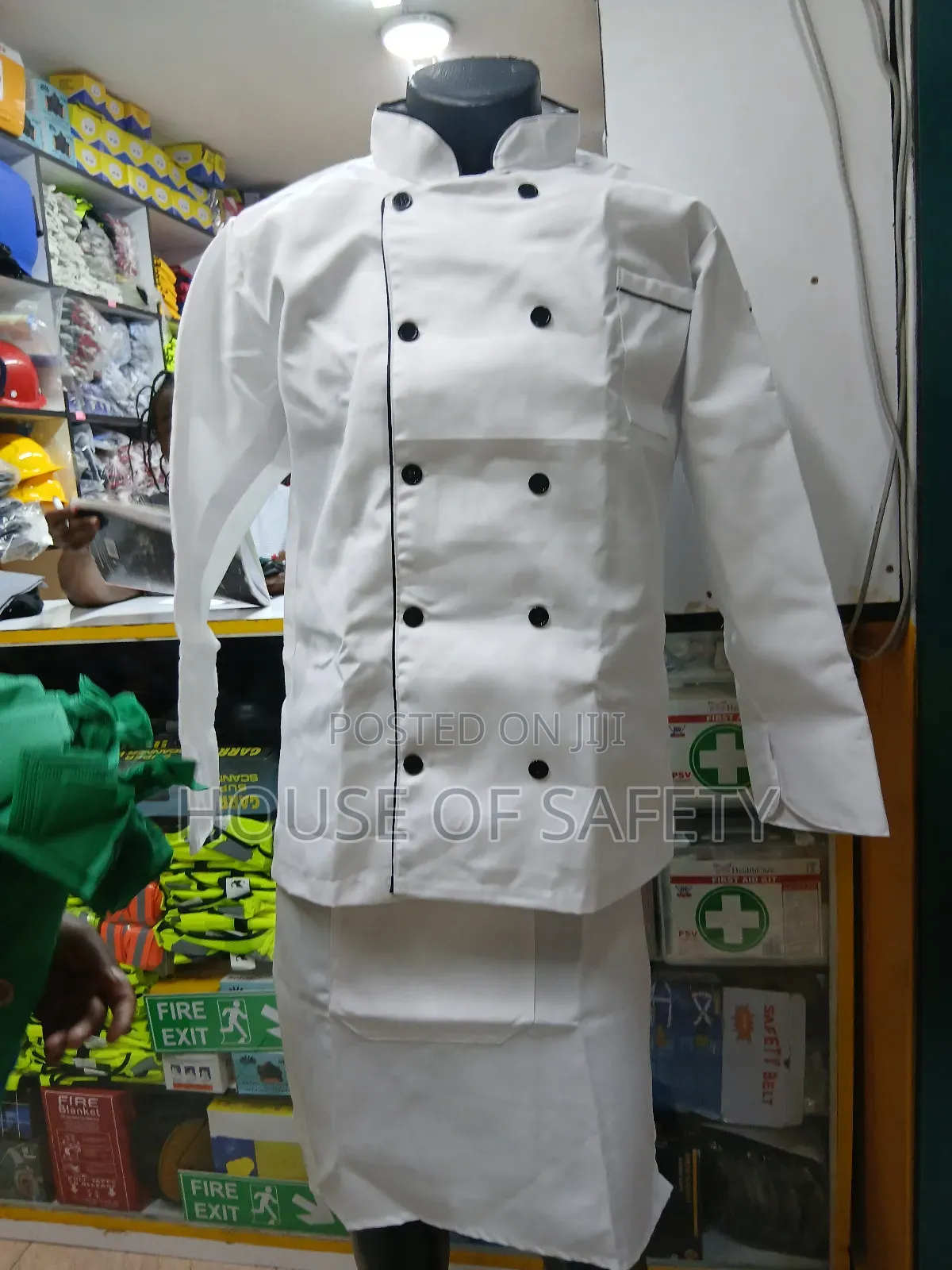 White Chef Coat Together With an Apron