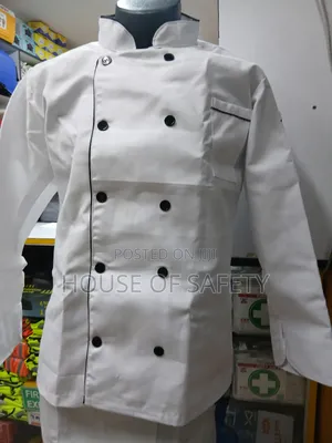 White Chef Coat Together With an Apron