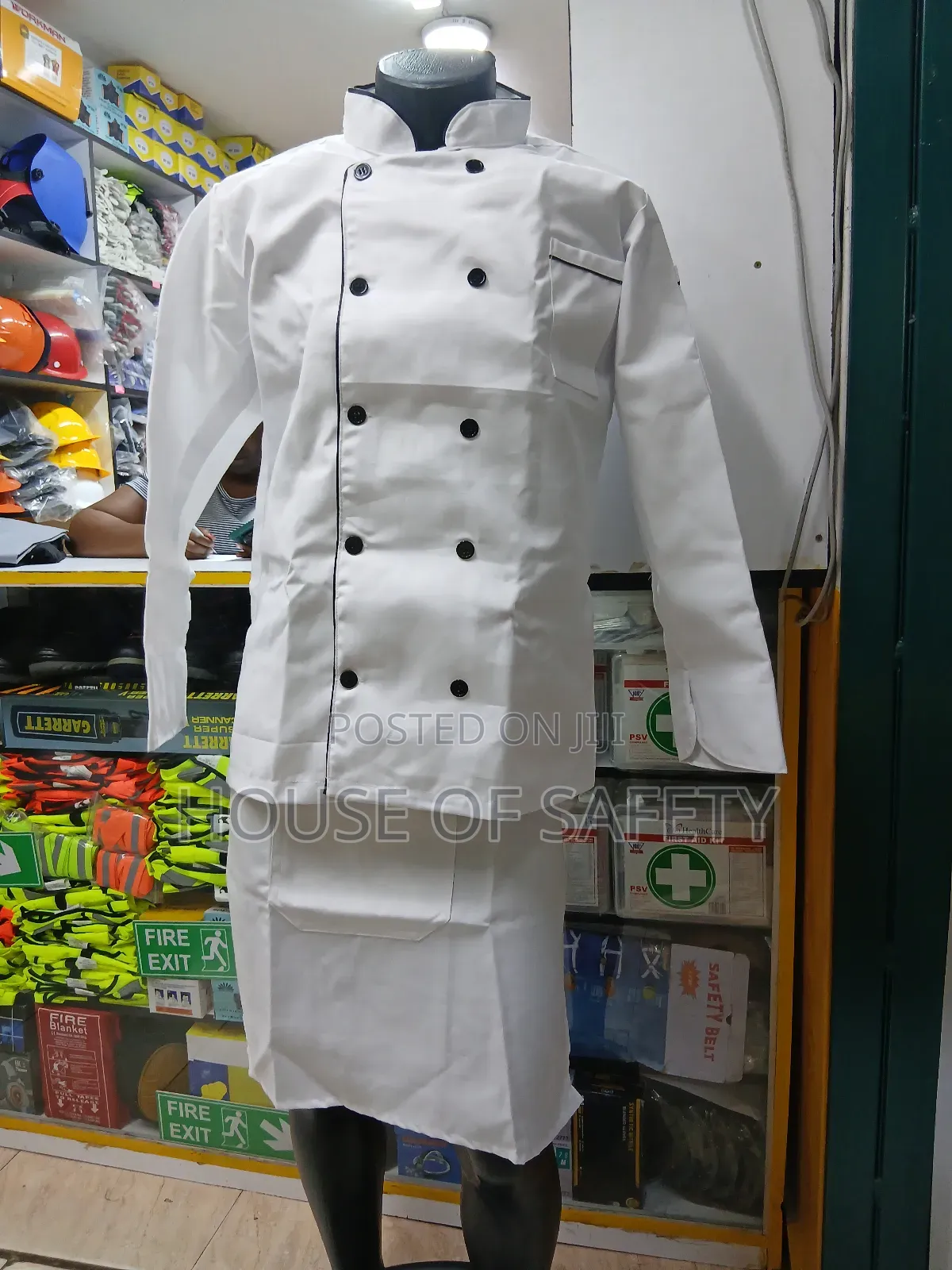 White Chef Coat Together With an Apron