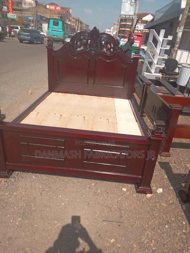 Stylish Wooden Bed With Carved Headboard - main view
