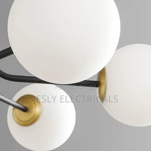 Modern Chandelier With Multiple Spherical, Opaque White Shades, Gold.