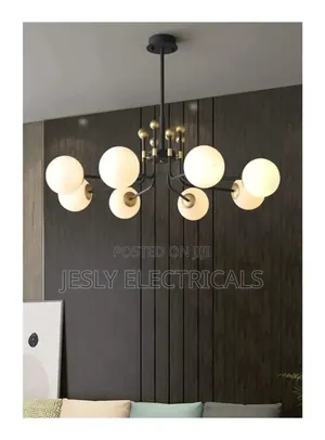 Modern Chandelier With Multiple Spherical, Opaque White Shades, Gold.