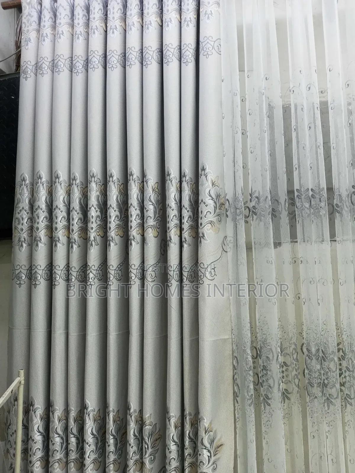 Light Grey Curtain With Leave Like Patches Design
