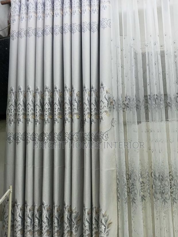Light Grey Curtain With Leave Like Patches Design
