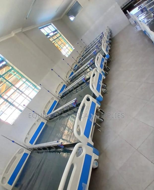 Single Crank Hospital Bed With Mattress, Mackintosh, And A Drip Stand
