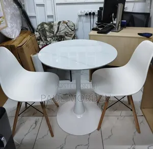 Round Dining Cafe Table With Two Eames Chairs