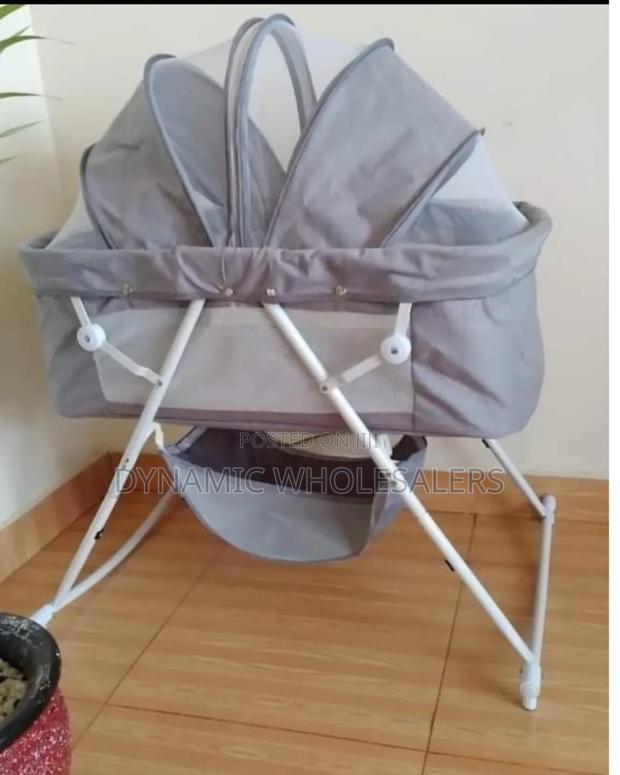 Elegant Baby Bassinet Sleeping In. - main view