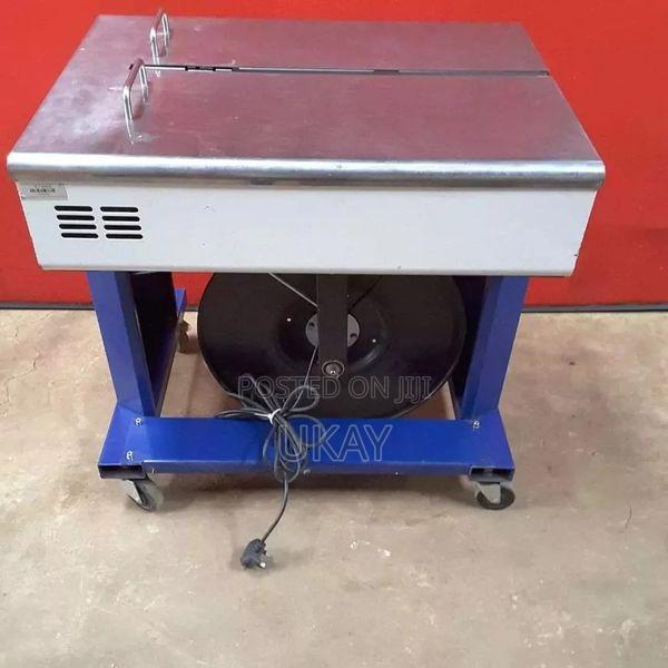 Semi Auto Strapping Machine.