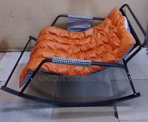 Rocking Chair With an Orange, Tufted Cushion