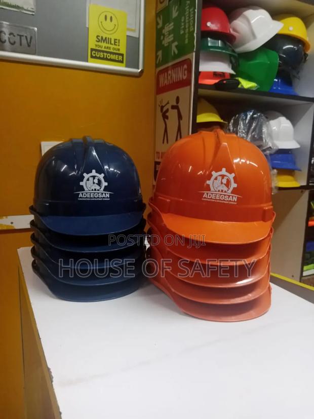 Yellow Helmet White And Blue Helmets