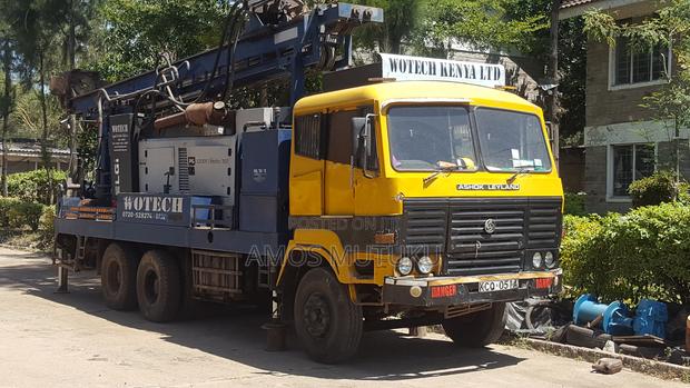 Drilling Rig, Support Truck And Pick Up