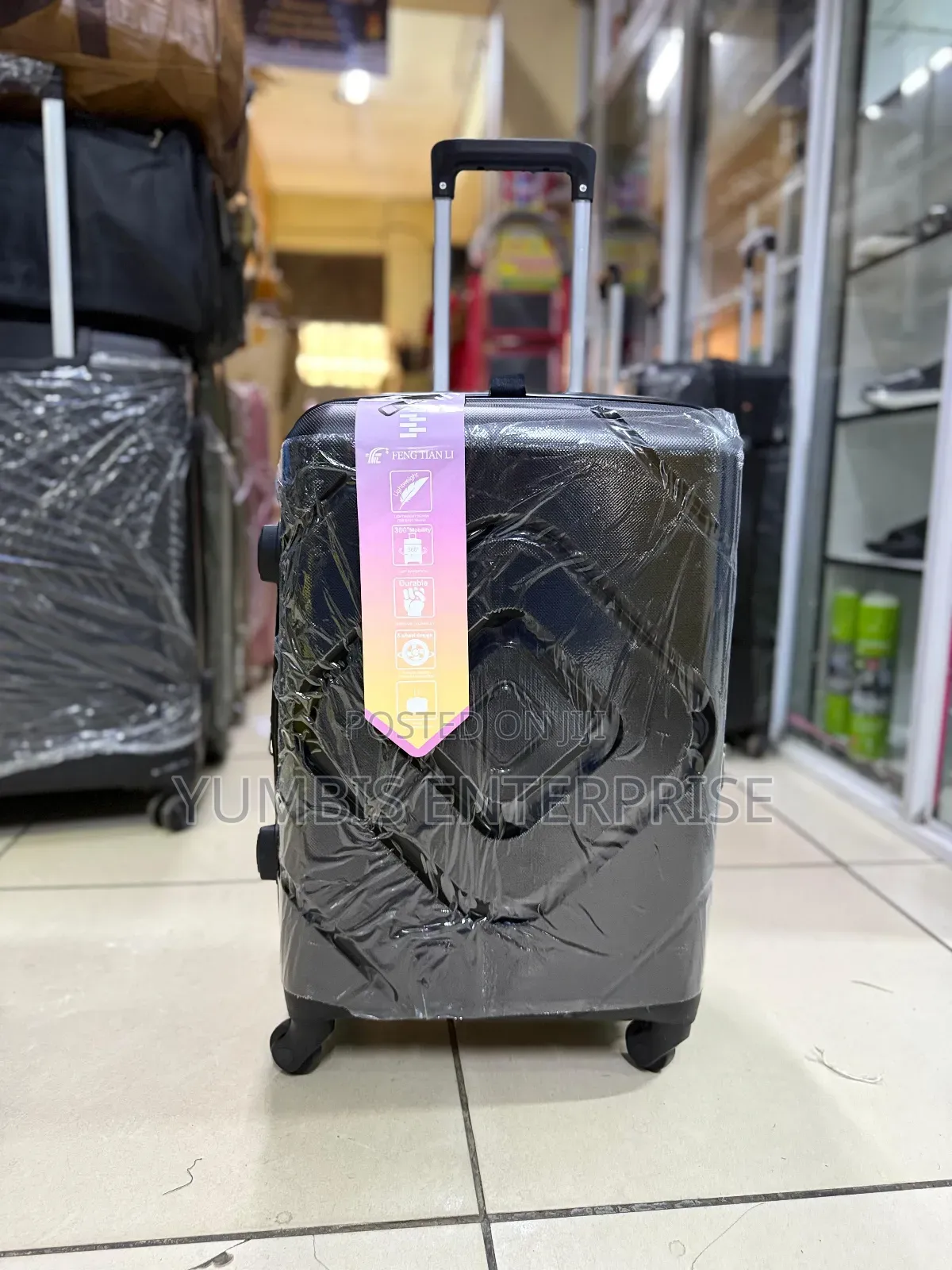 Small Suitcase at 2000. Black Rubber Suitcase