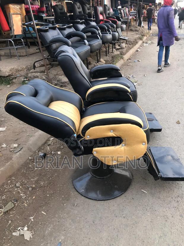 Adjusted Barber Chairs With Gold Leather - main view