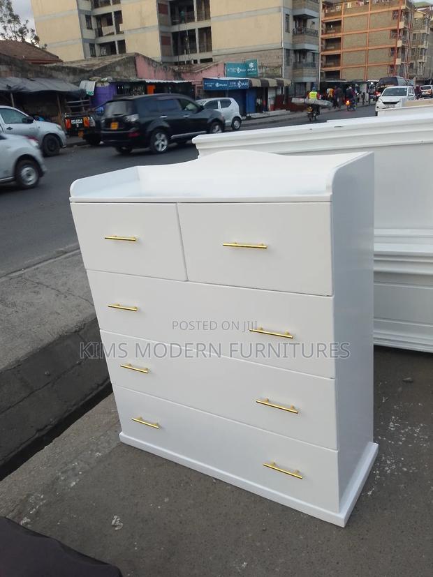 White Drawer Cabinet With Gold Handles and Ample Storage - main view