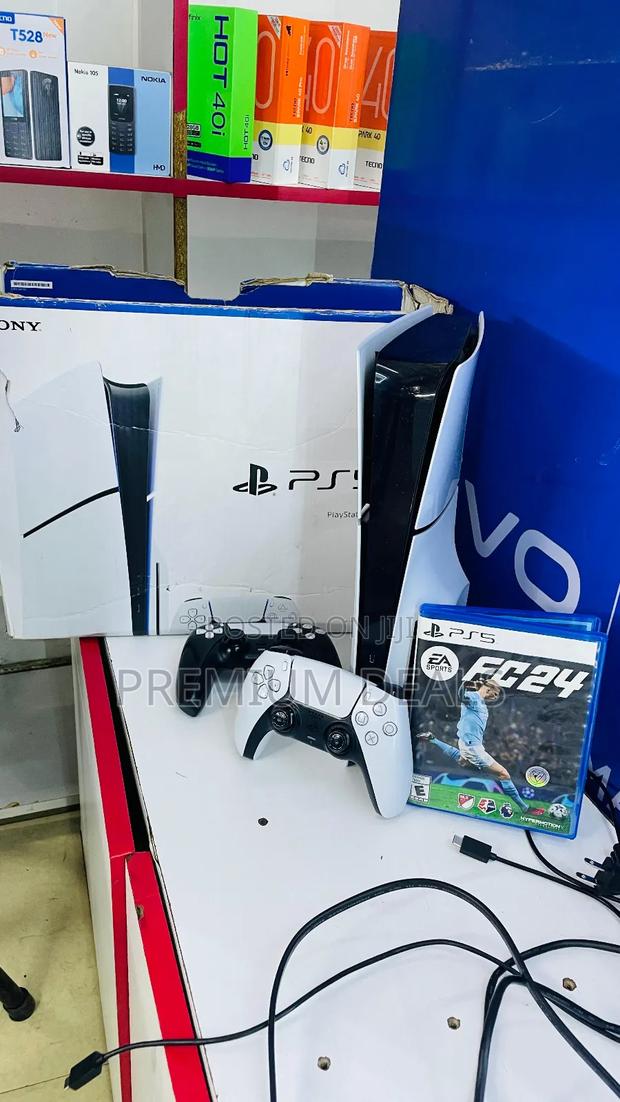 Ps5 Slim Clean With Two Controllers Boxed and One Game.