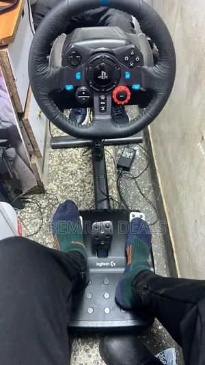 Complete Driving Wheel With Peddles and Shifter.
