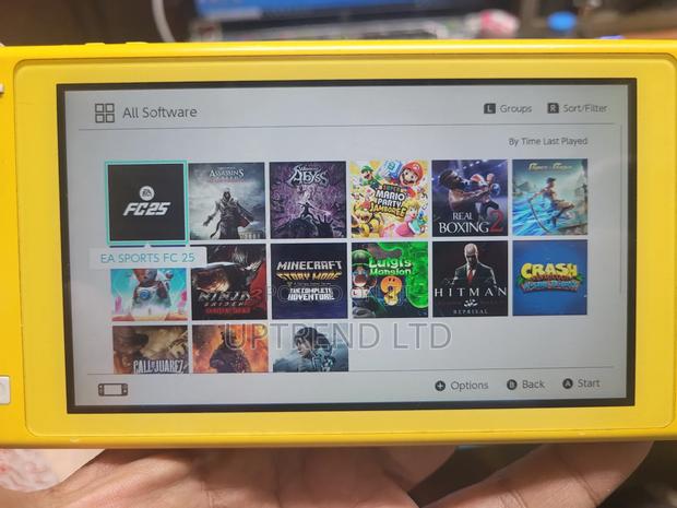 Yellow Chipped Nintendo Swith Lite Chipped With 20 Games