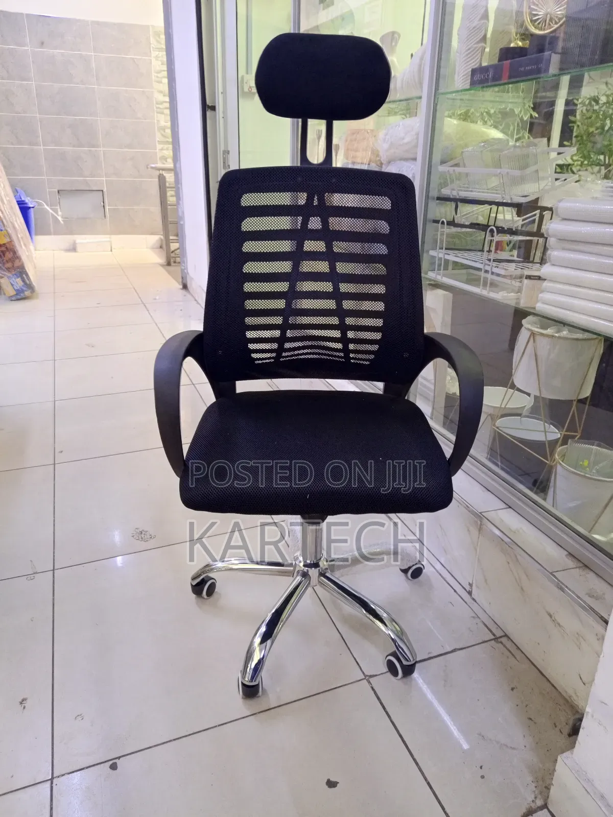 High-Back Mesh Ergonomic Office Chair With a Headrest and Armrests.