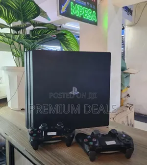 1tb Ps4 Pro With 19games and Two Controllers.