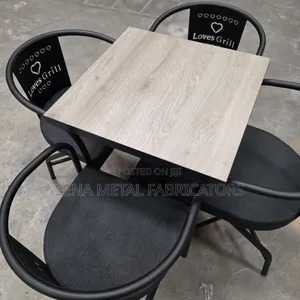 Black Restaurant Dining Set With Brown Table.
